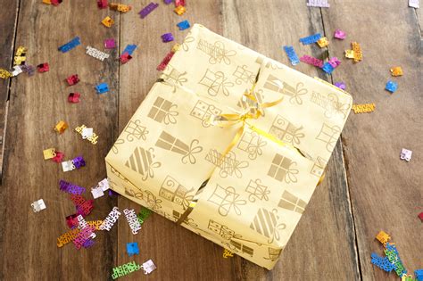 Free Stock Photo 11452 Yellow Birthday Gift on Table with Confetti ...