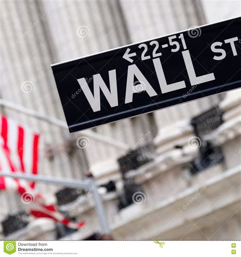 Wall Street Sign with the New York Stock Exchange on the Backgro Stock ...