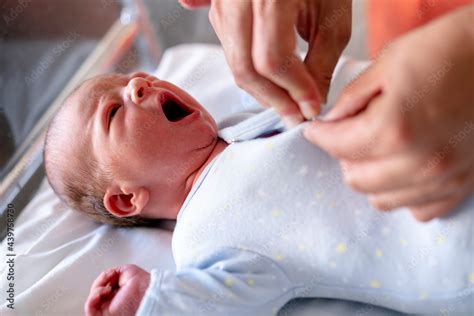 newborn baby yawning Stock Photo | Adobe Stock