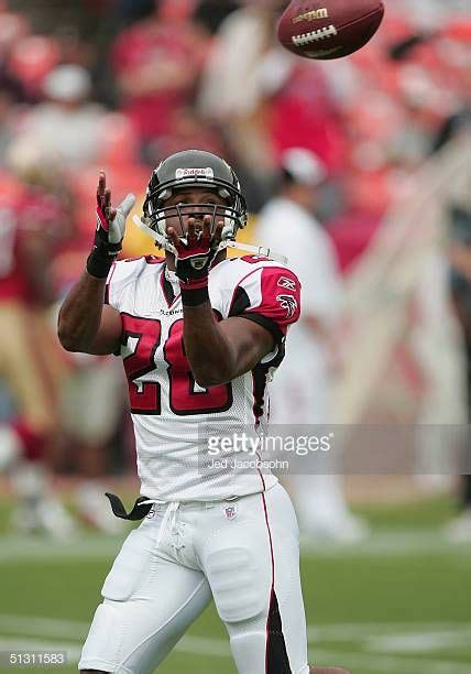 Running back Warrick Dunn of the Atlanta Falcons catches the ball ...