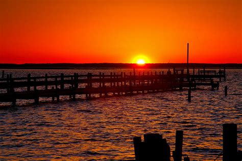 Docks And Sunset Photograph by Steven Ainsworth - Pixels