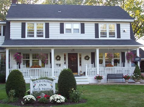 Dutch Colonial Inn | Colonial Porch Curb Appeal Ideas and Inspiration (with columns and railing ...