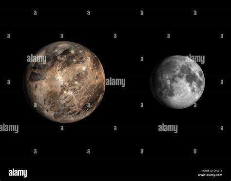 A rendered size comparison of the Jupiter Moon Ganymede and the Earth Moon on a clean black ...