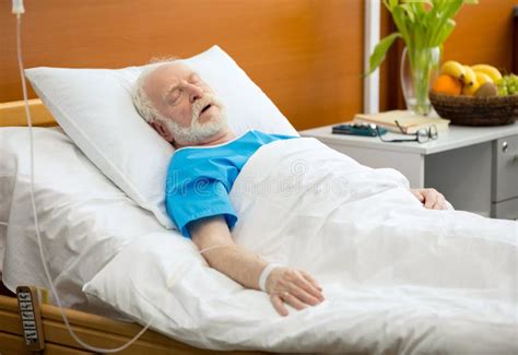 Senior man in hospital bed stock image. Image of person - 93020963