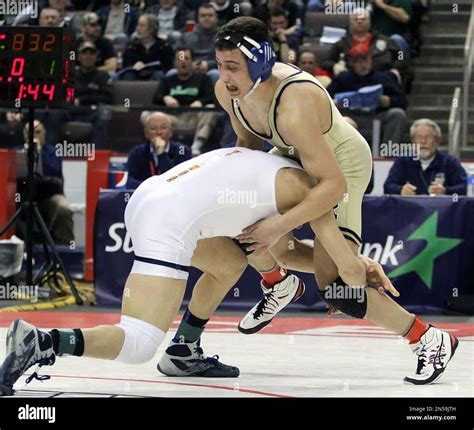 Pittsburgh Central Catholic's Vincenzo Joseph, left, takes a shot at Franklin Regional's Michael ...