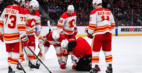 Flames' Tanev avoids major injury after taking slap shot to head | Offside