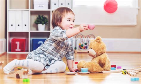 Happy toddler girl playing with her teddy bear - Window Covering Safety ...