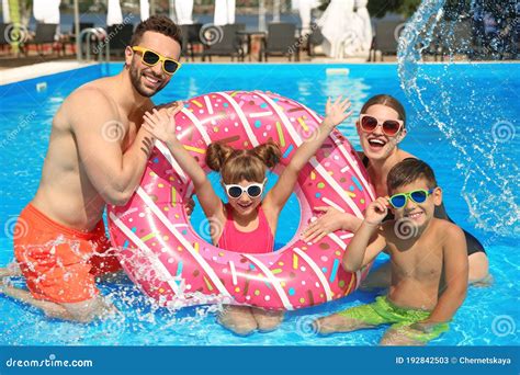 Family Fun In Swimming Pool - Mother, Father, Baby Dive Underwater ...