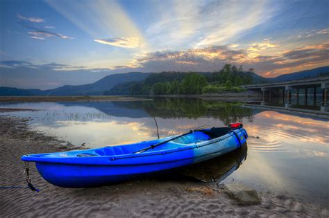 Blue Canoe at Sunset Photograph by Debra and Dave Vanderlaan - Fine Art America