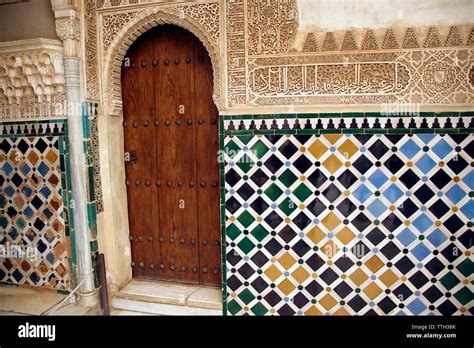 Islamic art tiled wall and door in the Alhambra Palace Stock Photo - Alamy