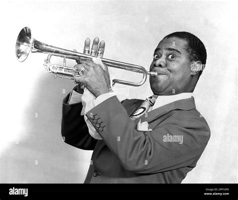 Louis Armstrong playing the trumpet. Portrait of the American jazz musician Louis Daniel ...