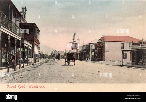 Albert Road, Woodstock, Cape Town, South Africa, with shops and a windmill. Date: circa 1908 ...