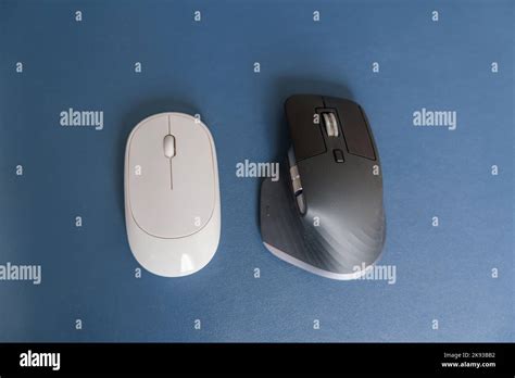 Comparison of Ergonomic vertical mouse and general mouse on desk at ...