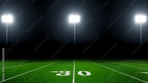 Football field illuminated by stadium lights Stock Photo | Adobe Stock