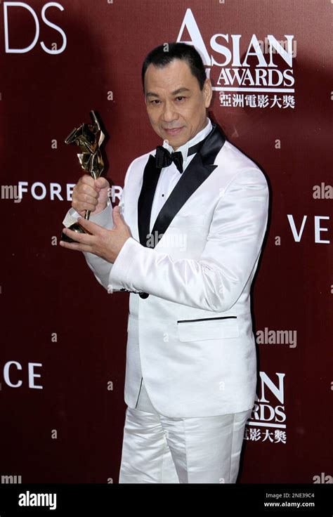 China's actor Wang Xueqi celebrates after winning the best actor of his movie “Bodyguards and ...