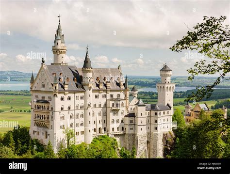 Neuschwanstein Castle is a nineteenth-century Romanesque Revival palace on a rugged hill near ...