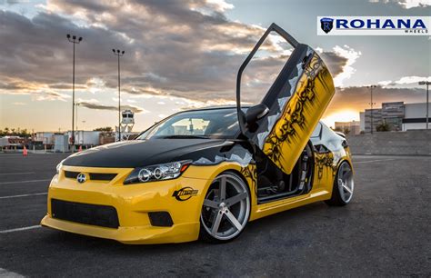 Yellow Scion TC with Custom Graphics and Lambo Doors — CARiD.com Gallery