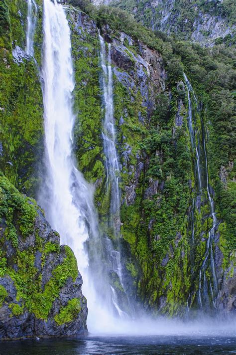 Huge waterfall in Milford Sound, Fiordland National Park, UNESCO World Heritage Site, South ...