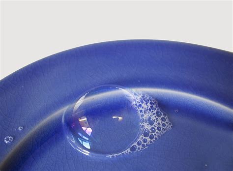 large bubble and soap suds on bright cobalt blue plate aga… | Flickr