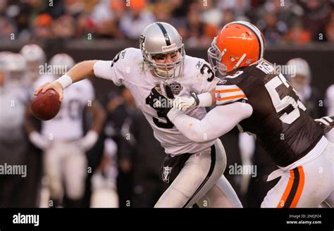 Oakland Raiders quarterback Charlie Frye (3) is sacked by Cleveland ...