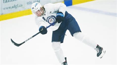 Jets' star Patrik Laine listed day-to-day with upper-body injury | CBC Sports