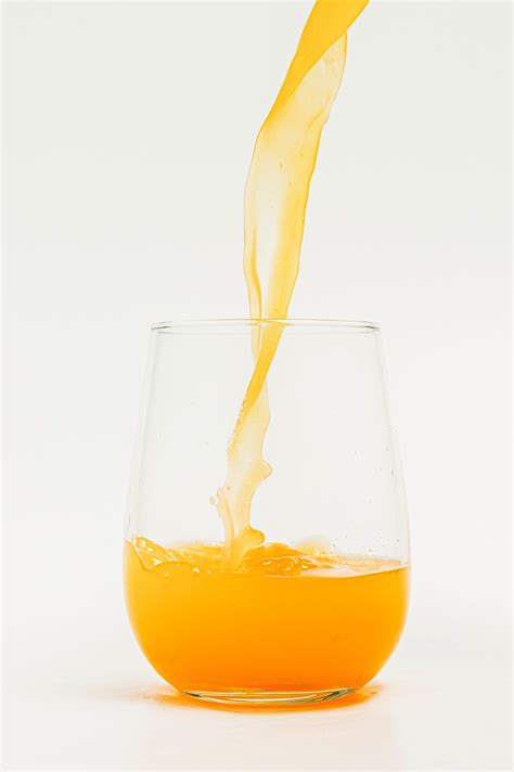 Pouring fresh organic orange juice | Premium Photo - rawpixel