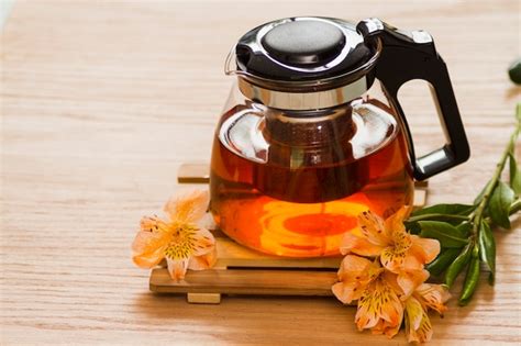 Free Photo | Glass teapot with flowers