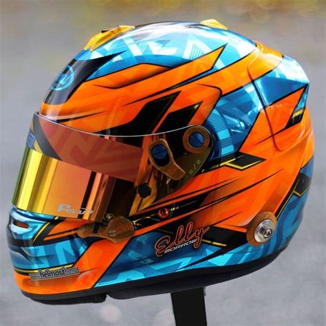 a helmet is shown on top of a stand with the visor painted orange and blue