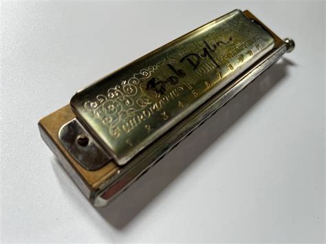 Bob Dylan Signed Harmonica - CharityStars