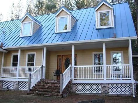 Traditional house with blue roof color — Freshouz Home & Architecture Decor | House paint ...