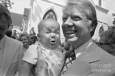 Jimmy Carter Holds Crying Baby Photograph by Bettmann | Fine Art America