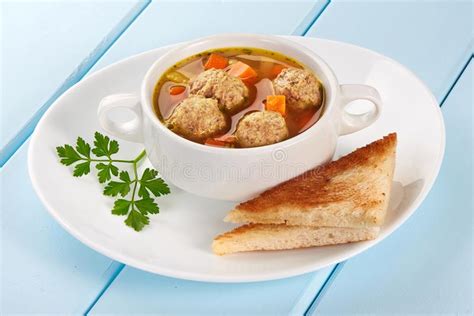 A Bowl of Soup with Meatballs with Toasted Bread Stock Photo - Image of ...