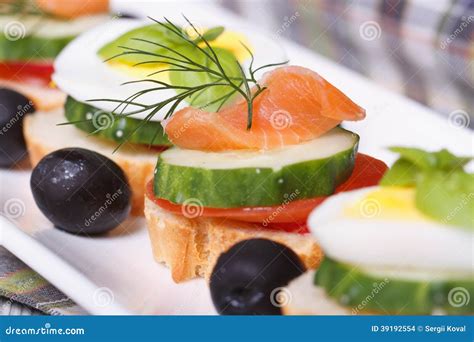 Canapes with Salmon, Cucumber, Tomato and Dill Stock Photo - Image of ...