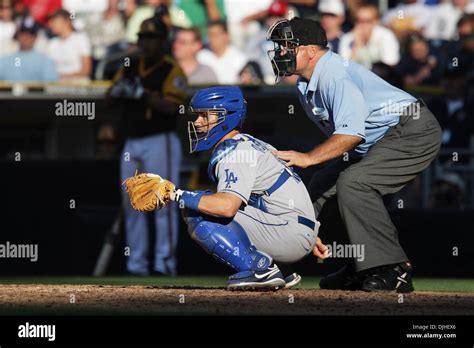 Dodgers catcher Brad Ausmus and umpire Brian O'Nara behind the plate against the Padres during ...