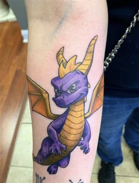 Spyro tattoo by Tina Miller | Nintendo tattoo, Tattoos, Cartoon tattoos