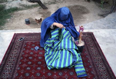 Stunning Afghan Tailor Woman Sewing a Gown