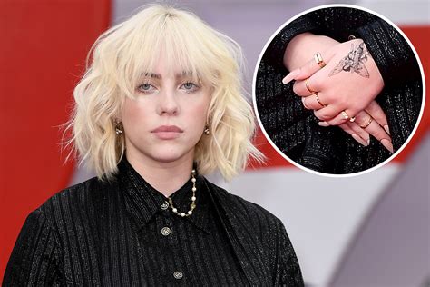 Billie Eilish debuts fairy hand tattoo at James Bond premiere