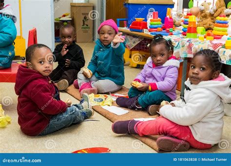 Two African Kids Eating Mandioca With Their Own Hands Editorial Image ...