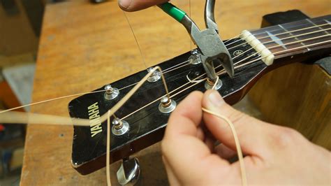 How to restring an acoustic guitar: step-by-step guidance from a ...