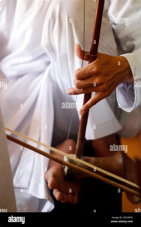 Cao Dai temple. Cao Dai worshipper play music at service. Phu Quoc ...