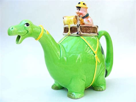 Flinstones Dinosaur teapot ... Fred Flinstone riding on back of bright green dinosaur, ceramic ...