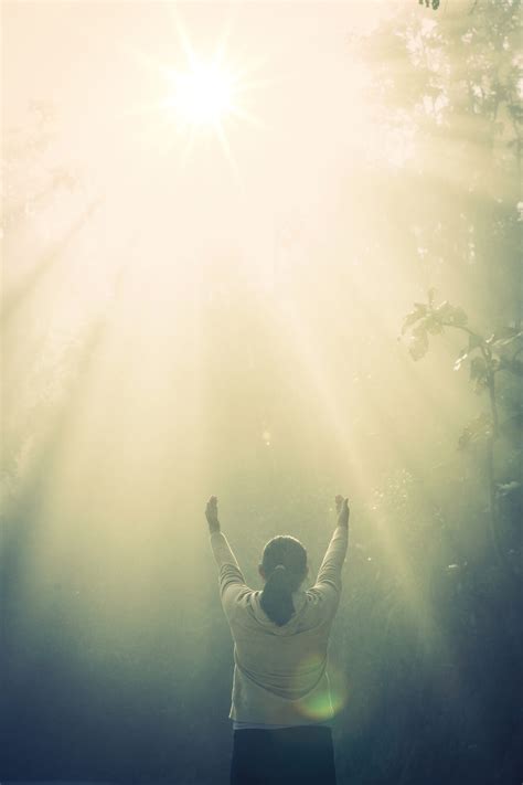 Teenage girl with praying in sunny nature. Young girl meditate i | Grey ...