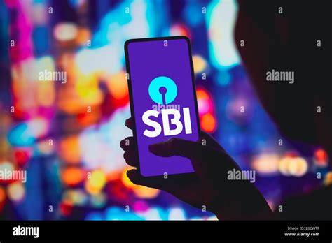 In this photo illustration, the State Bank of India (SBI) logo is displayed on a smartphone ...