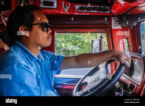 Mark, a jeepney driver, drives a traditional jeepney to transit passengers. For decades ...