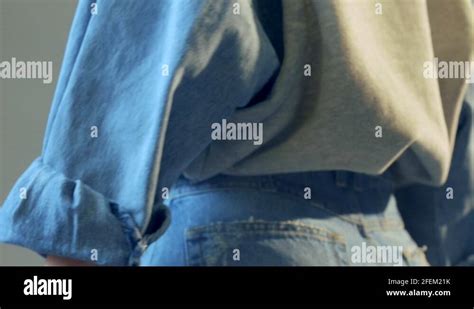 Woman wearing jeans and jumper Stock Videos & Footage - HD and 4K Video Clips - Alamy