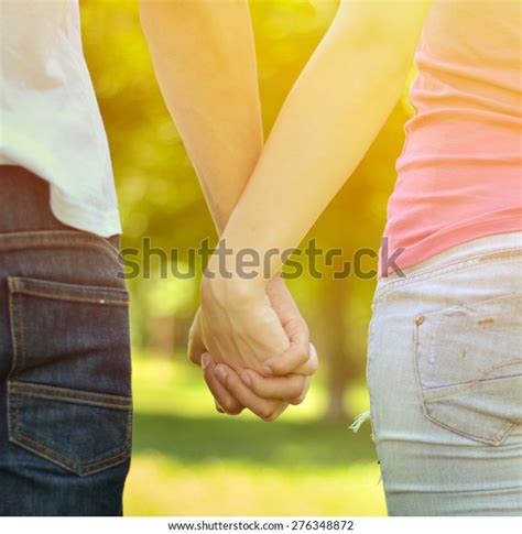 Couple Holding Hands Stock Photo (Edit Now) 276348872