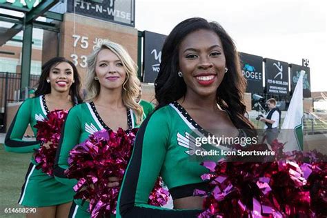 The North Texas Mean Green Cheerleaders get ready to run onto the ...