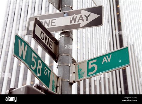 5th Avenue street sign and one way street signs at West 58th St in New ...