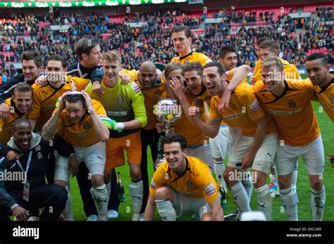 Cambridge United FC players celebrating with the FA Trophy after ...