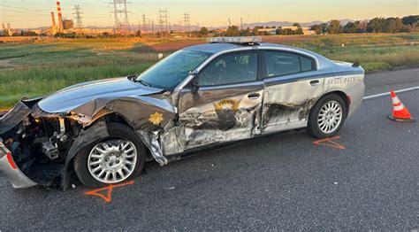 A dozen parked Colorado State Patrol cars have been struck by drivers ...